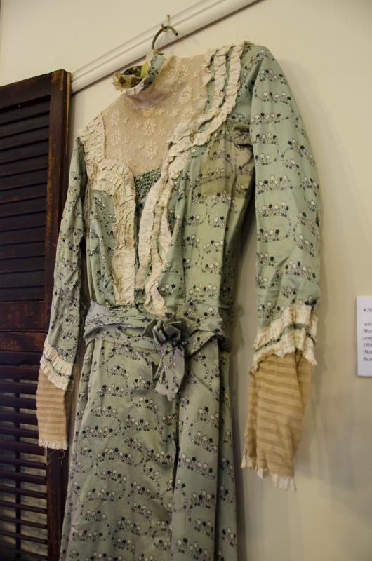 Many pieces in the exhibit, including this green silk print dress, were made by Margaret Benner. BY GEORGIA SPARLING